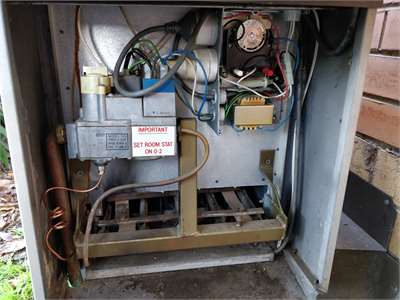 Ducted heating unit undergoing service