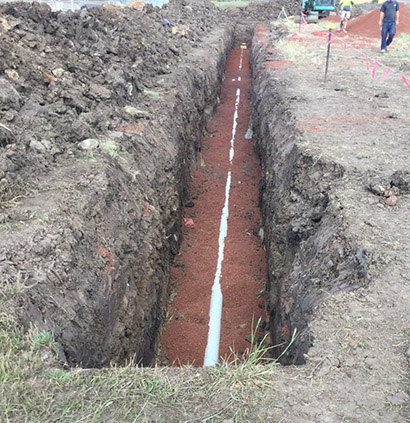Below-ground sanitary drain
