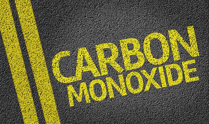 'Carbon Monoxide' painted on a road
