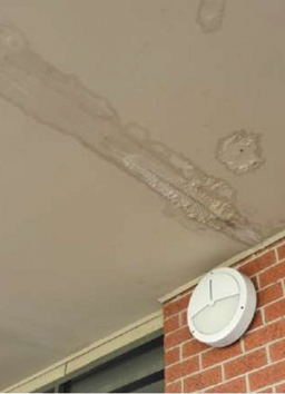 Water marks and surface spalling are indicative of water ingress. 
